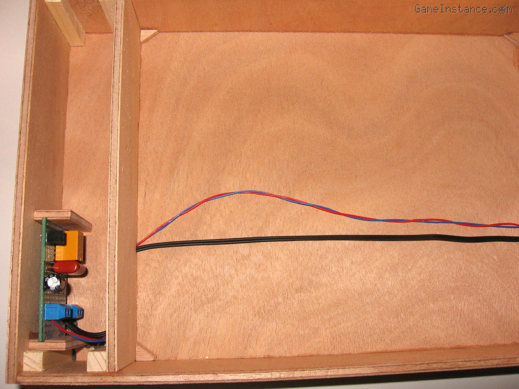 UV-Box - Wiring the bottom side. The high voltage electronics PCB can be observed on the left side compartment.